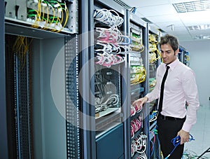 Young it engeneer in datacenter server room