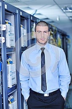 Young it engeneer in datacenter server room