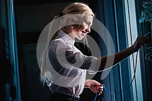 Young engineer businesswoman in server room