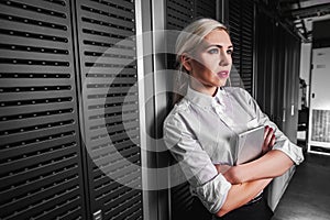 Young engineer businesswoman in server room