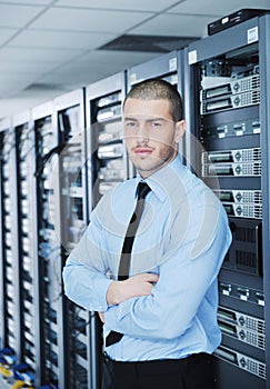 Young it engineer in datacenter server room