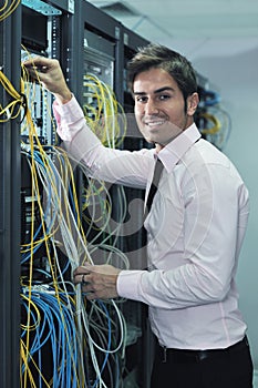 Young it engineer in datacenter server room