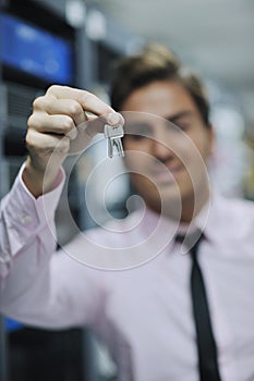 Young it engineer in datacenter server room