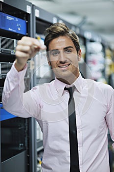 Young it engineer in datacenter server room