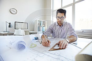 Young Engineer Drawing Plans