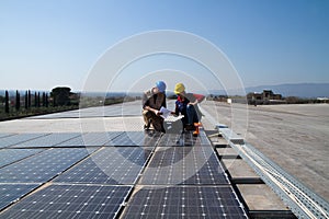 Young engineer girl and skilled worker on a roof