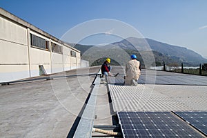 Young engineer girl and skilled worker on a roof