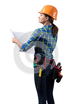 Young engineer in hard hat with blueprint