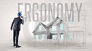 Young engineer holding blueprint