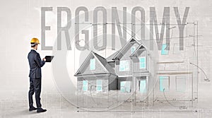 Young engineer holding blueprint