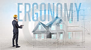 Young engineer holding blueprint