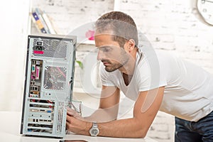 Young engineer repaired computer