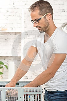 Young engineer repaired a computer