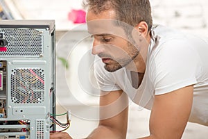 Young engineer repaired a computer