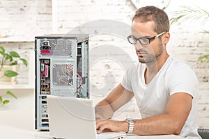 Young engineer repaired a computer