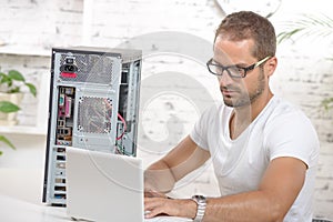 Young engineer repaired a computer