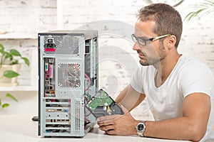 Young engineer repaired a computer
