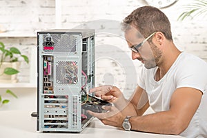 Young engineer repaired a computer