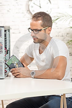 Young engineer repaired a computer