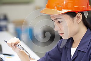 Young engineer using vernier in the laboratory research concpet