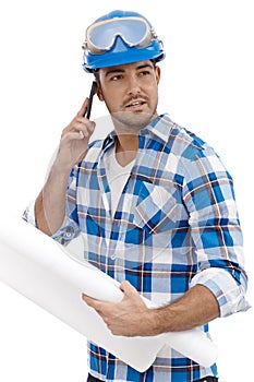 Young engineer working in hardhat