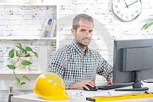 Young engineer working on his computer