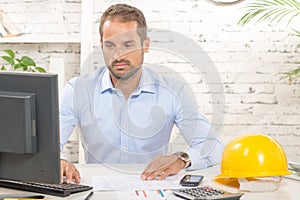 Young engineer working on his computer