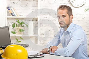 Young engineer working in his office