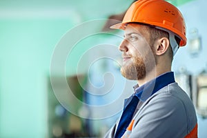 Young engineer at workplace in factory