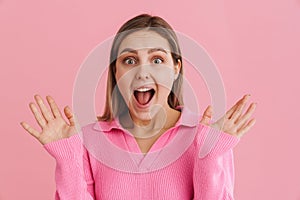 Young enthusiastic girl with wide opened eyes and mouth