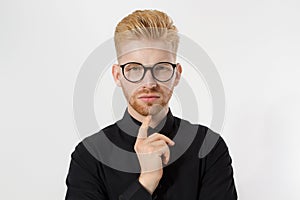 Young entrepreneur Generate Business Ideas. Close up of thinking Man in black shirt and glasses isolated, copy space. Self