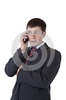 Young entrepreneur listens to client on phone