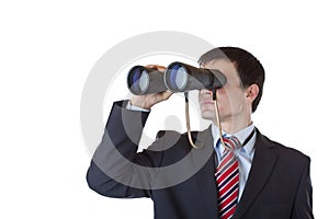 Young entrepreneur peers through binoculars photo