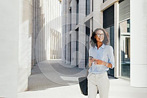 Young entrepreneur standing at office building