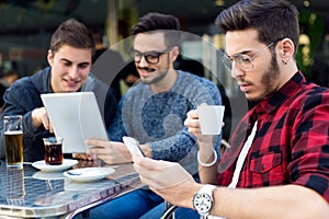 Young entrepreneurs working at coffee bar.