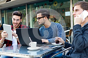 Young entrepreneurs working at coffee bar.