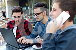 Young entrepreneurs working at coffee bar.