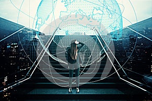 Young european businesswoman standing on stairs with abstract globe hologram. Business, growth and success concept. Double