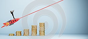 Young european businesswoman with telescope standing on flying rocket, growing golden coin chart and mock up place on light wall.