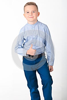 Young european cute boy show thumb up and smile on white background