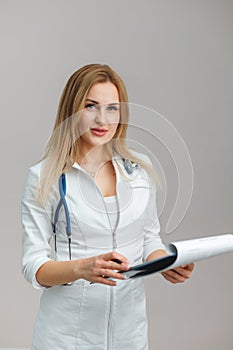 Young European Doctor Examines the Anamnesis, Medical Record of the Patient.