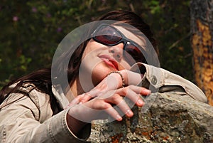 Young European girl in dark glasses.