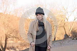 Young european girl dressed in fashionable sweater and coat