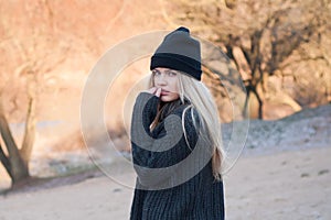 Young european girl dressed in fashionable sweater and coat