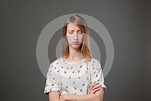 Young european sad woman serious and concerned looking worried and thoughtful