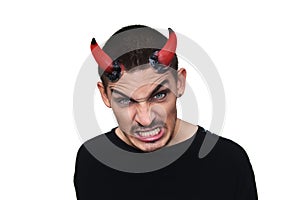 Young evil man with horns on his head