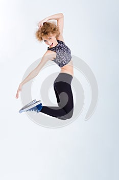 Young excited woman jumping