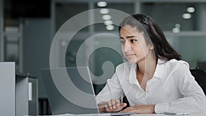 Young excited woman losing online gambling game upset female office worker works on laptop getting frustrated due to