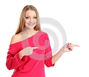 Young excited woman point finger showing something