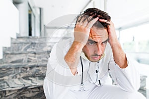 Young Exhausted Doctor After Severe Surgery